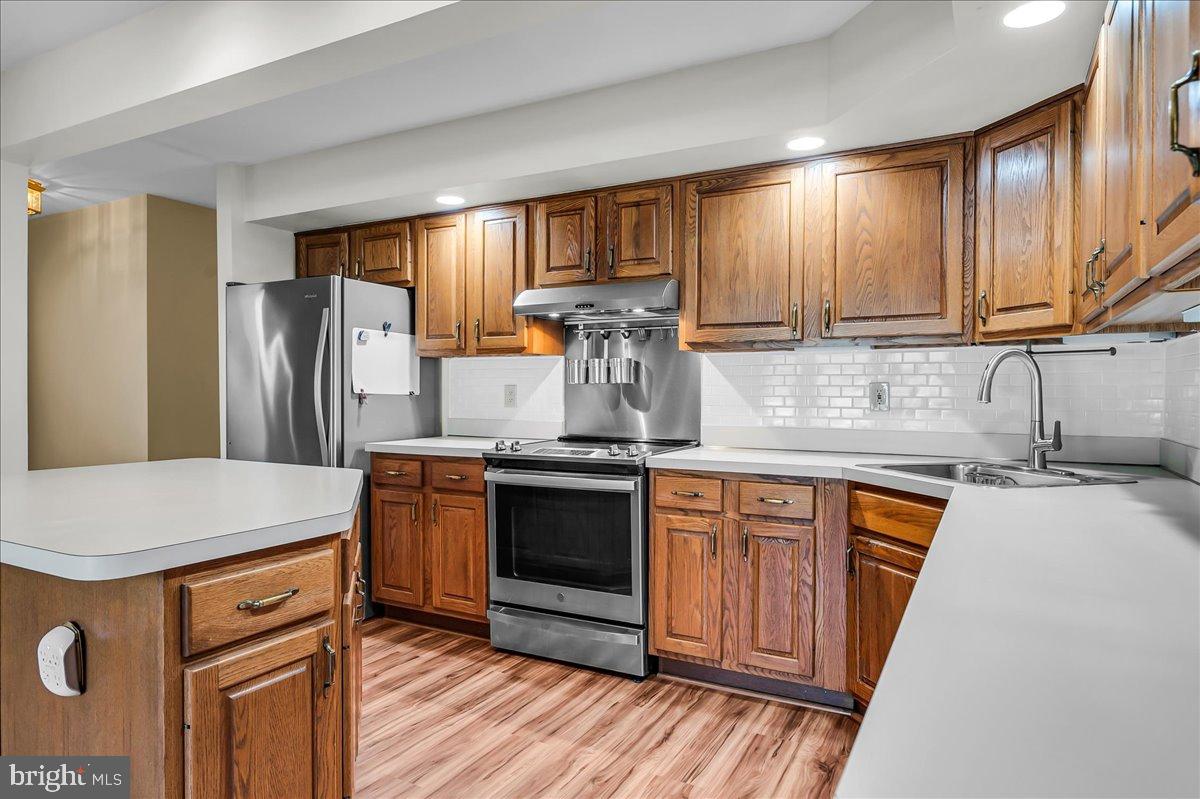 17 Southampton Parish Road Landenberg, PA 19350 - Photo 12 of 37 a kitchen with stainless steel appliances granite countertop wooden cabinets a sink a stove a refrigerator and island with wooden floor