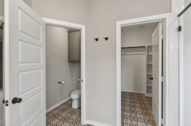 a view of bathroom with a toilet and a shower