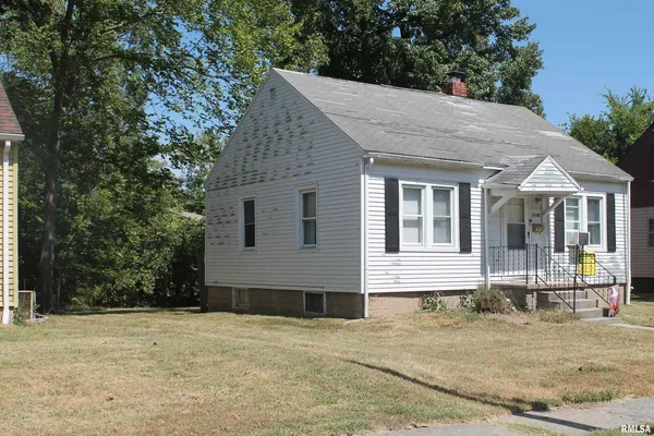a house with trees in the background
