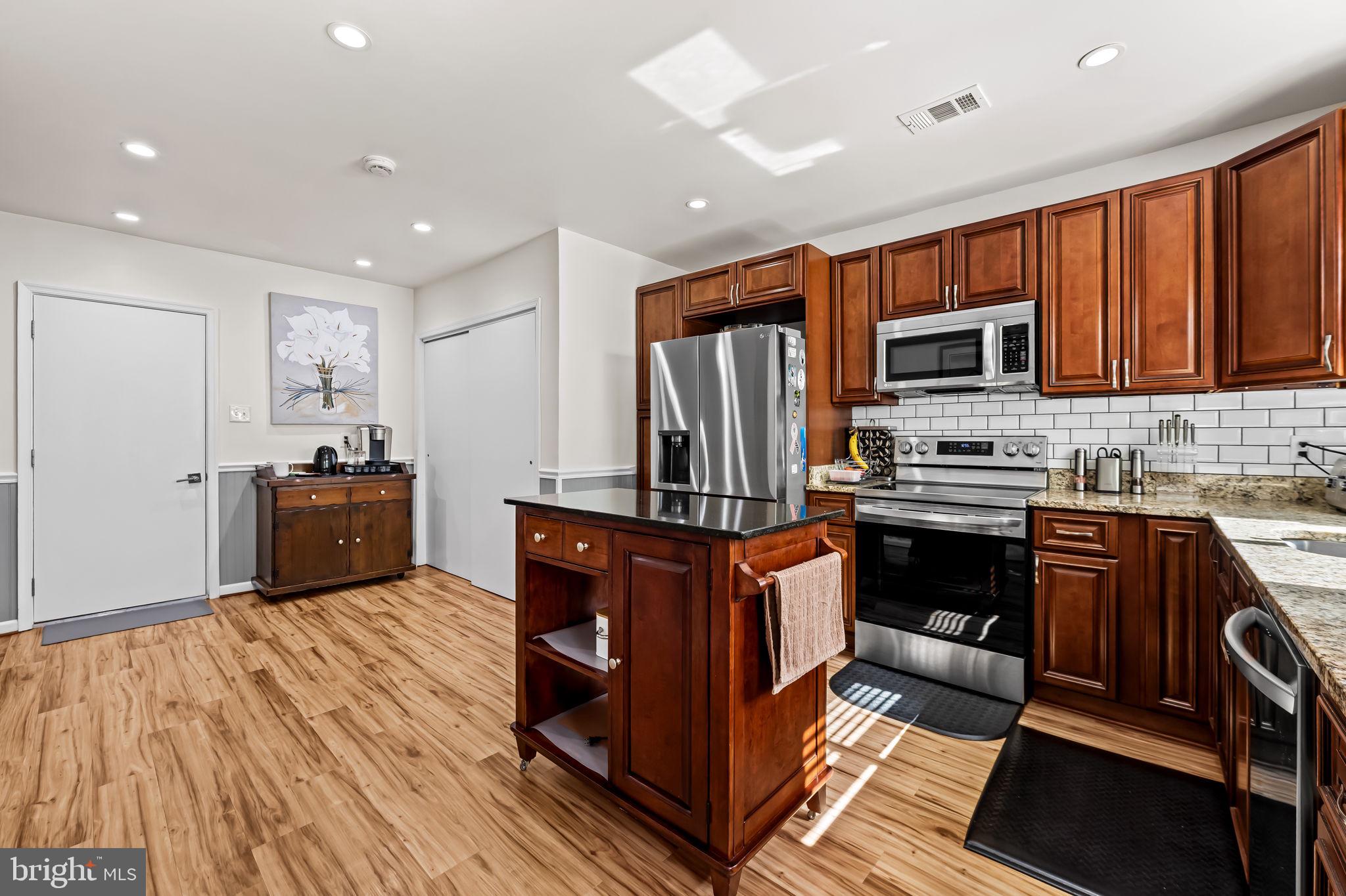 132 Talbot Road Stevensville, MD 21666 - Photo 8 of 40 The kitchen features granite countertops