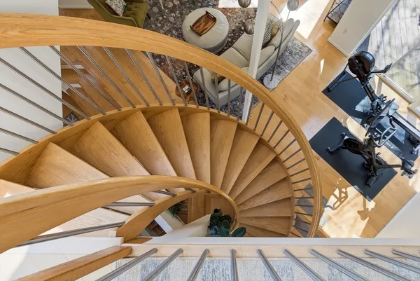 a living room with furniture and stairs