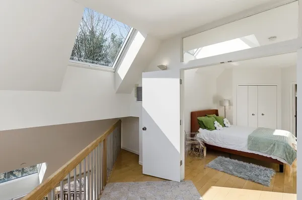 a living room with furniture and windows