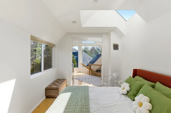 a bathroom with a granite countertop sink toilet a mirror and shower