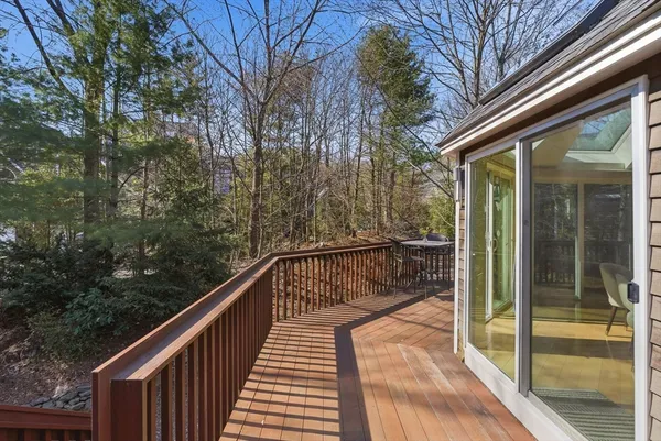 a view of balcony with furniture and wooden floor