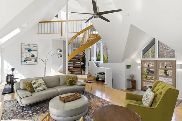 a living room with furniture and a painting