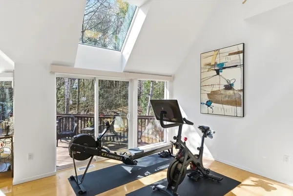 a view of entryway and hall with wooden floor