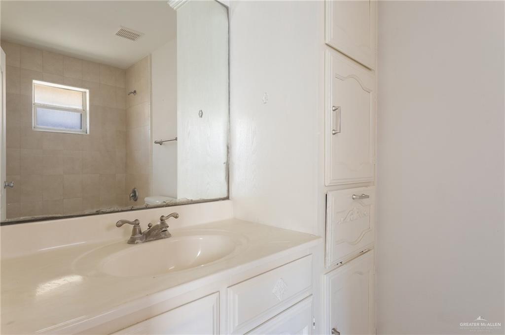 705 West Bronze Drive, Unit 3 Pharr, TX 78577 - Photo 13 of 13 a bathroom with a sink and a mirror
