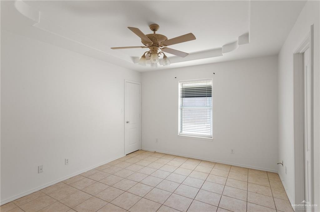 705 West Bronze Drive, Unit 3 Pharr, TX 78577 - Photo 7 of 13 an empty room with windows and fan
