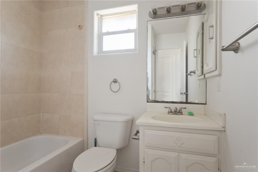 705 West Bronze Drive, Unit 3 Pharr, TX 78577 - Photo 10 of 13 a bathroom with a sink toilet and shower