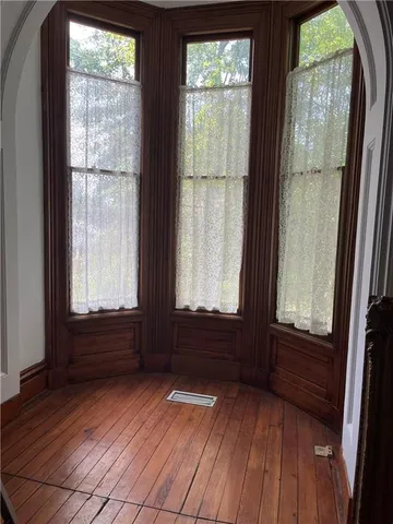 a view of front door with wooden floor