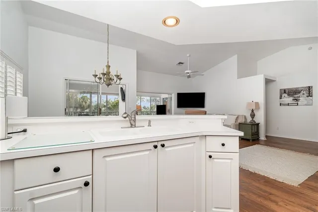 a kitchen with a sink and cabinets