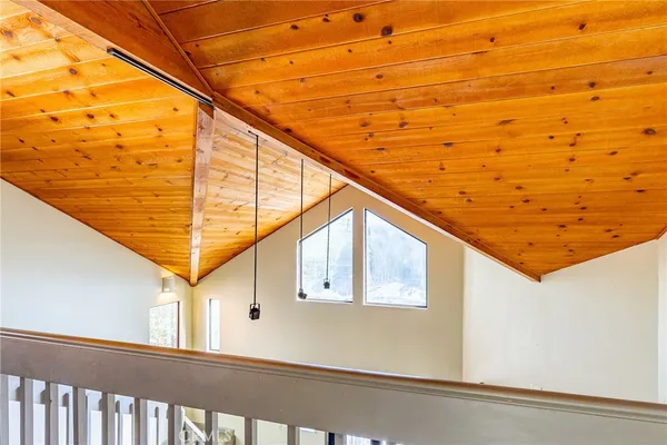 a view of living room with furniture and a fireplace