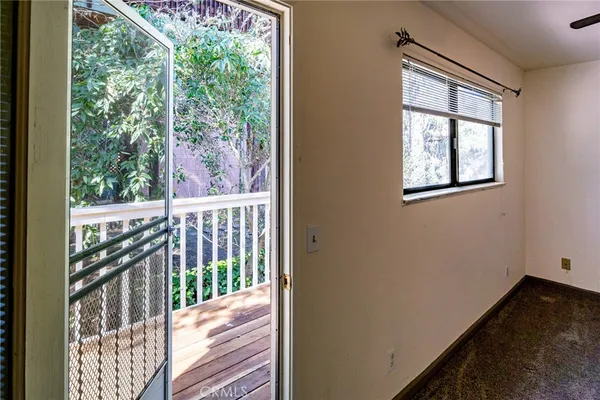 a view of balcony with wooden floor