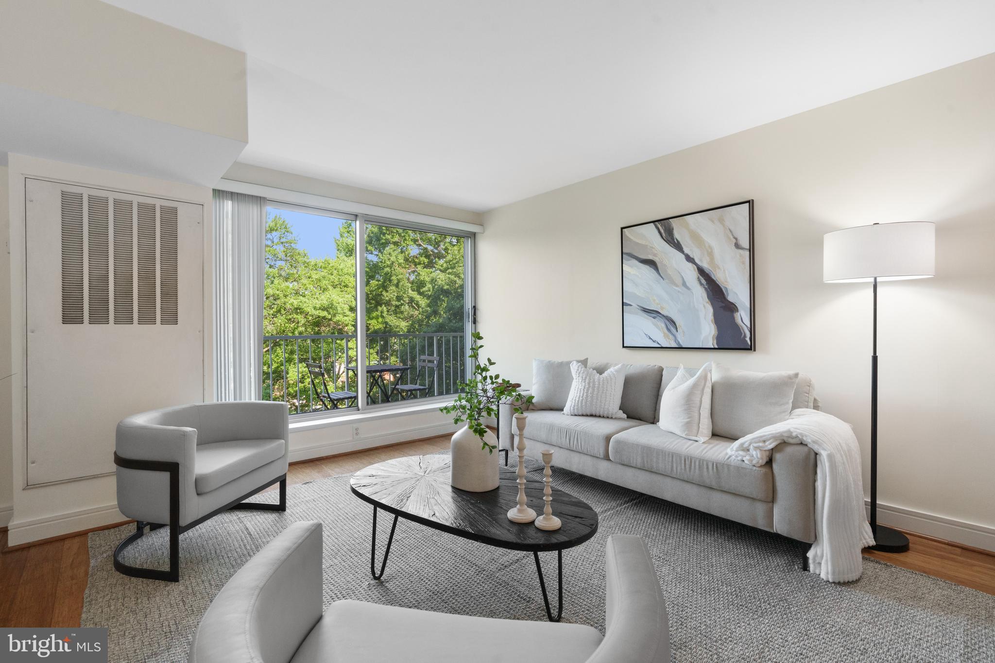800 4th Street Southwest, Unit S421 Washington, DC 20024 - Photo 2 of 30 a living room with furniture and a large window
