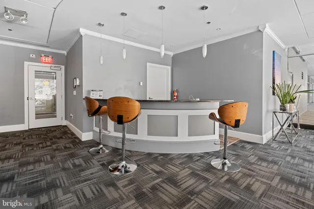 a living room with furniture a flat screen tv and a large window