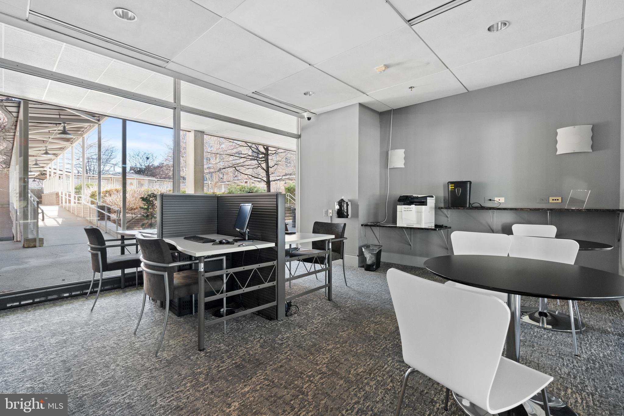 800 4th Street Southwest, Unit S421 Washington, DC 20024 - Photo 24 of 30 a living room with furniture a flat screen tv and a large window