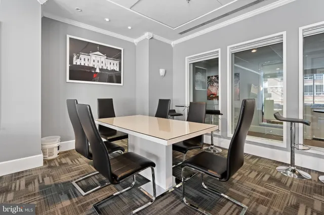 a room with furniture pool table and flat screen tv