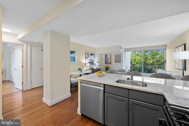 a room with a sink window and wooden floor