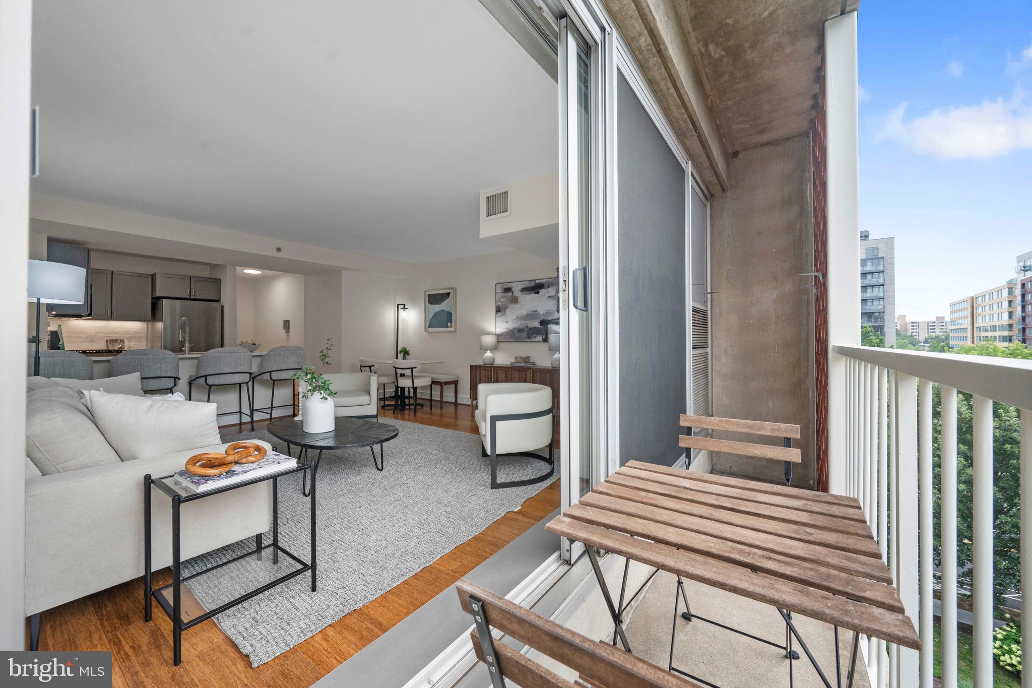 800 4th Street Southwest, Unit S421 Washington, DC 20024 - Photo 7 of 30 a living room with furniture and a wooden floor