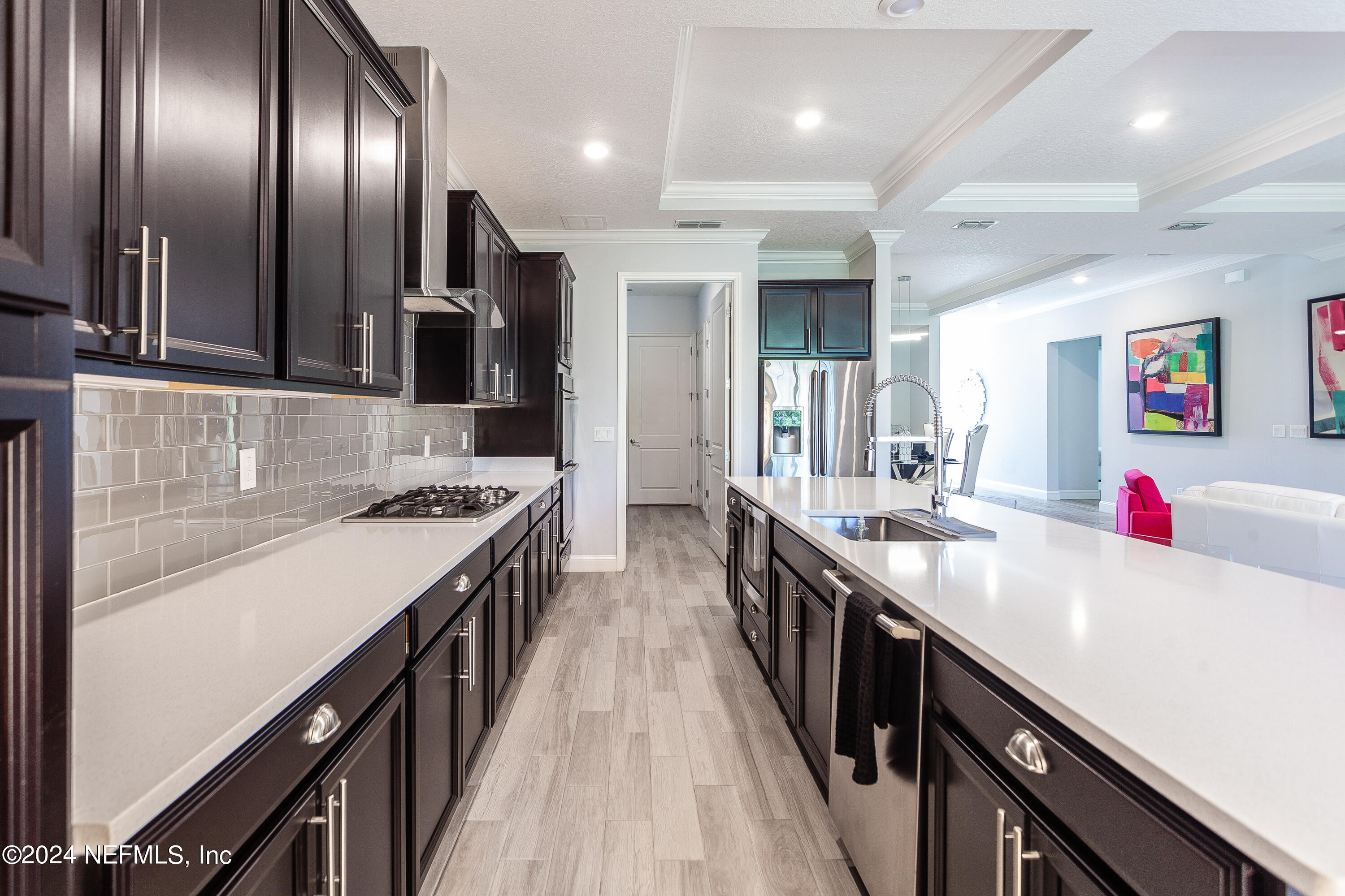 175 Caribbean Place St. Johns, FL 32259 - Photo 11 of 41 a kitchen with stainless steel appliances granite countertop a sink a stove and a refrigerator