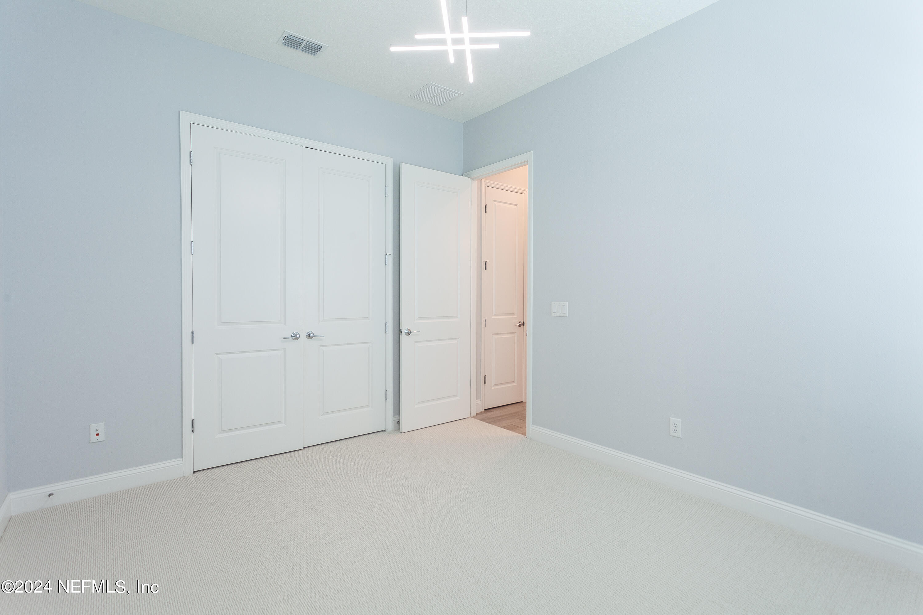 175 Caribbean Place St. Johns, FL 32259 - Photo 21 of 41 an empty room with a chandelier fan