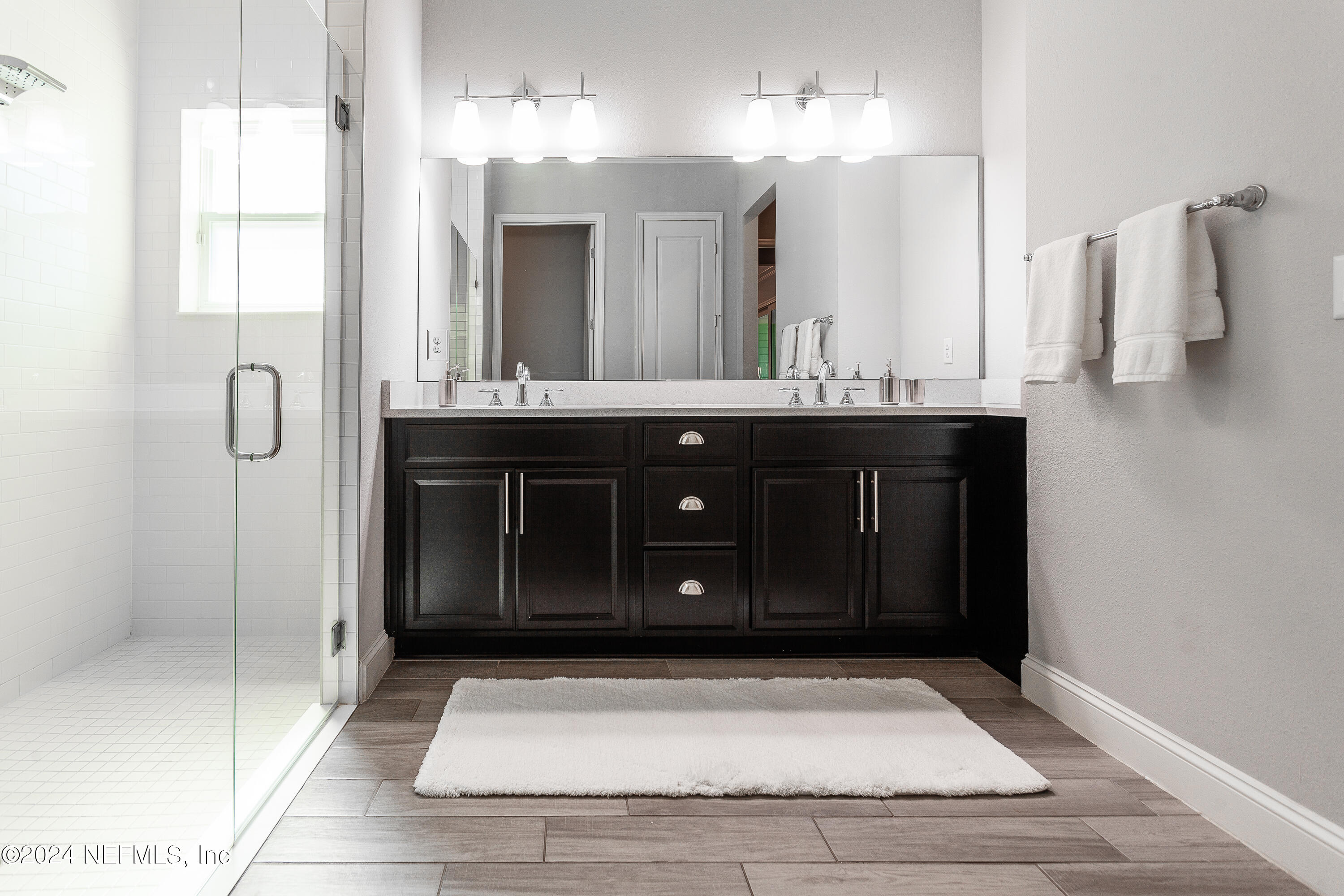 175 Caribbean Place St. Johns, FL 32259 - Photo 24 of 41 a bathroom with a sink a counter and a mirror