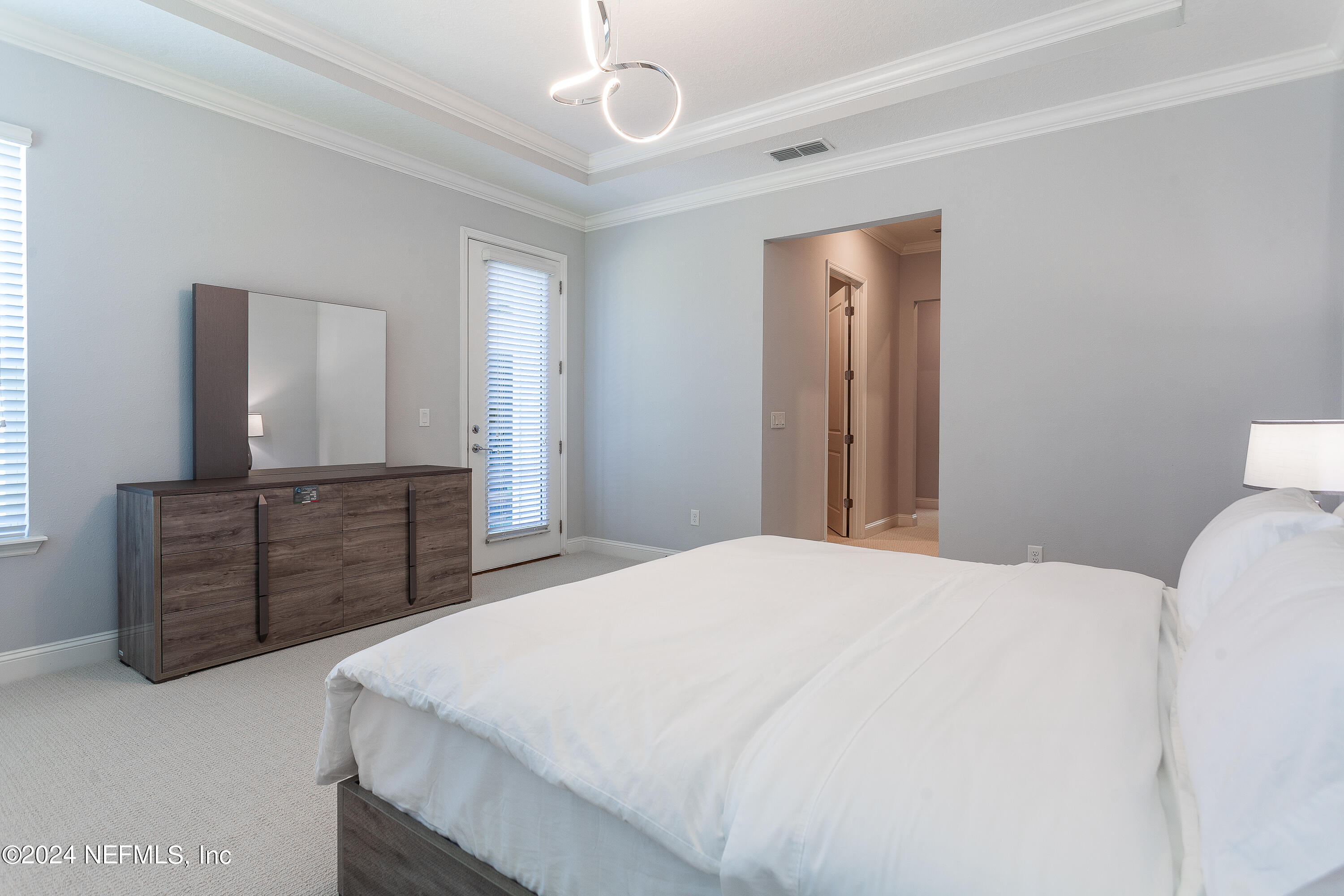 175 Caribbean Place St. Johns, FL 32259 - Photo 28 of 41 a bedroom with a bed and a dresser