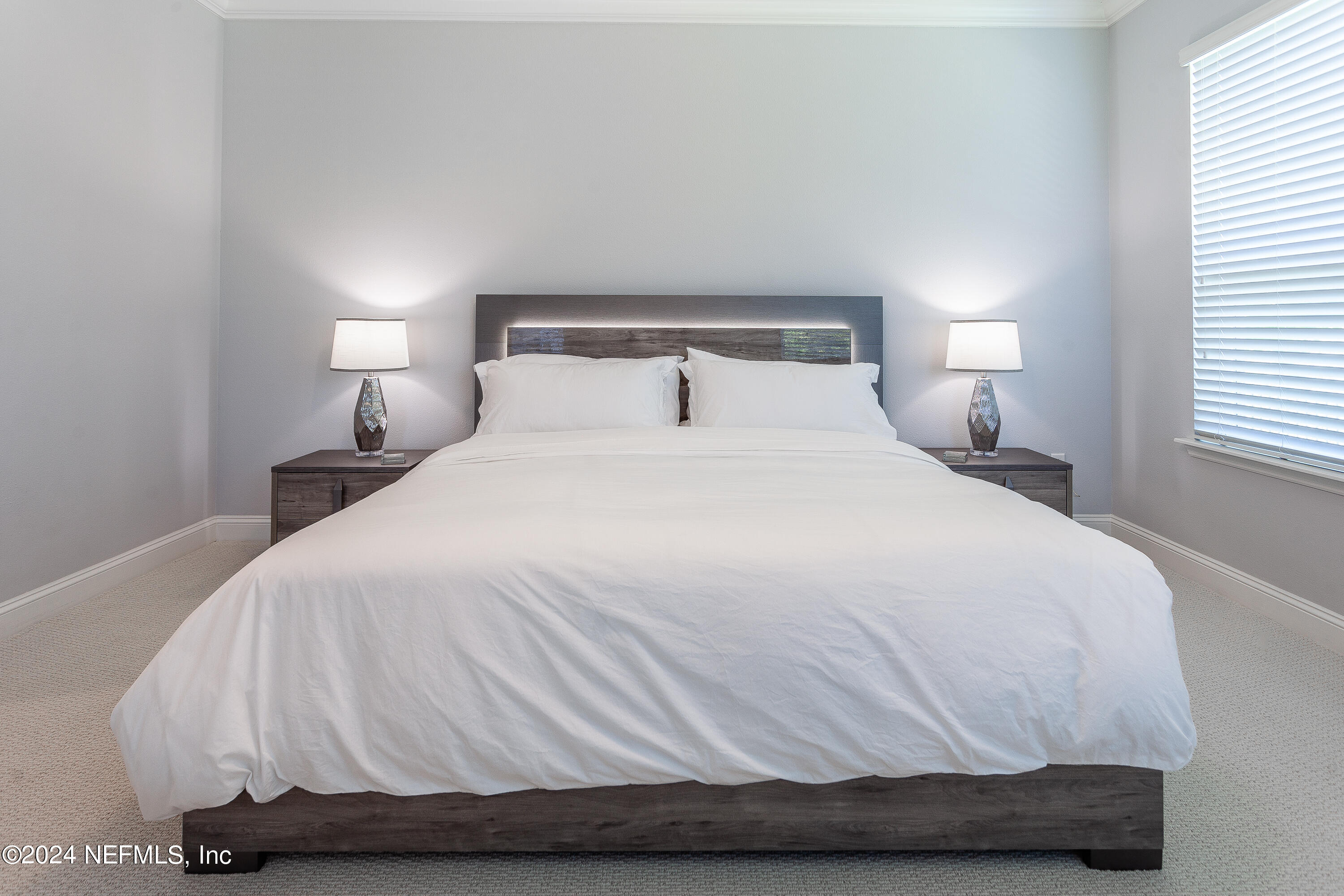 175 Caribbean Place St. Johns, FL 32259 - Photo 29 of 41 a large white bed sitting in a bedroom next to a lamp