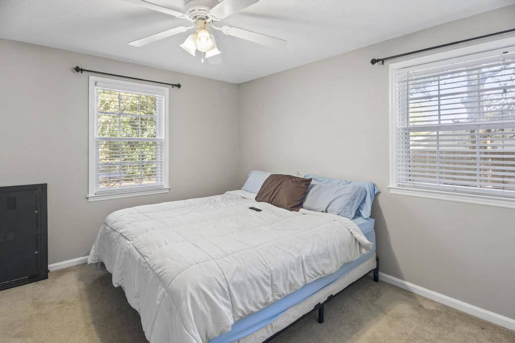 1934 Huntsman Drive Aiken, SC 29803 - Photo 14 of 19 a bedroom with a large bed and a window