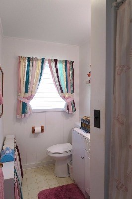 4851 Malu Road Kapaa, HI 96746 - Photo 8 of 17 a white toilet sitting next to a bathroom sink
