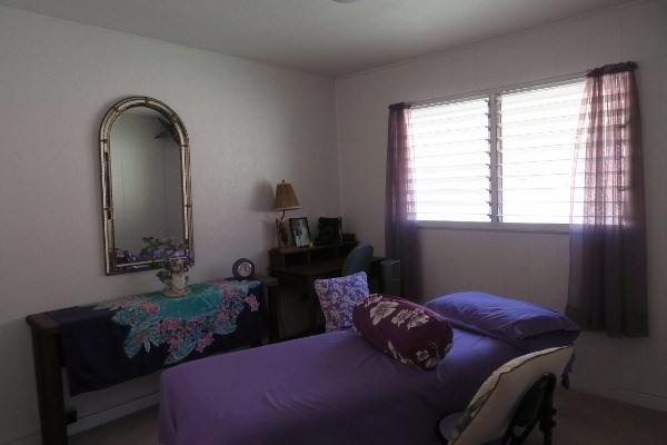4851 Malu Road Kapaa, HI 96746 - Photo 9 of 17 a bedroom with a bed and window