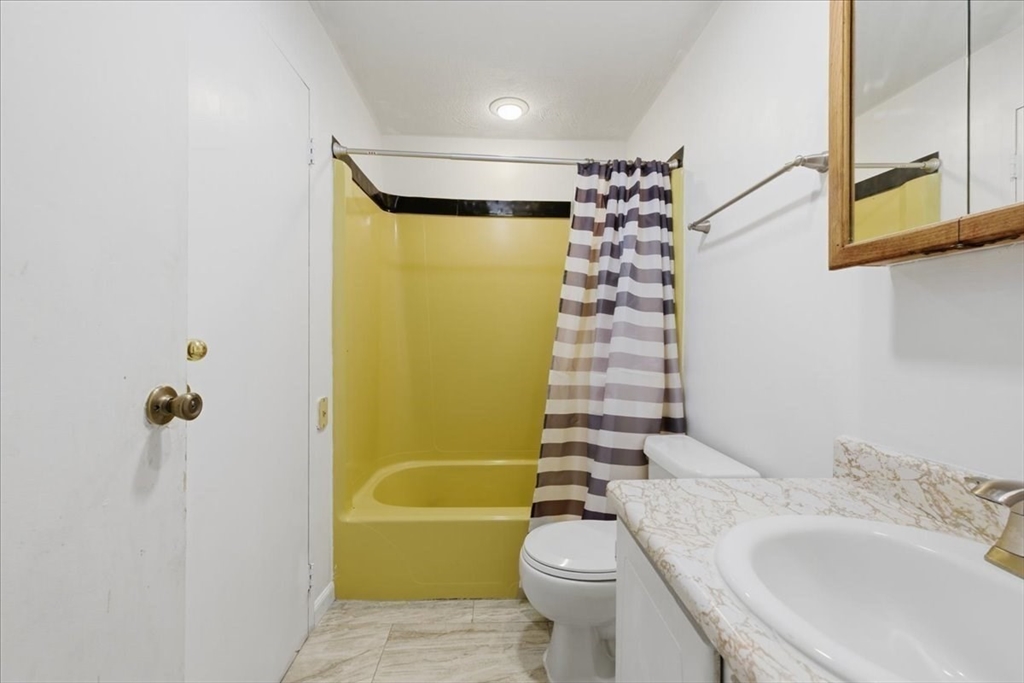 232 Canton Street, Unit 308 Randolph, MA 02368 - Photo 17 of 41 a bathroom with a sink toilet and shower