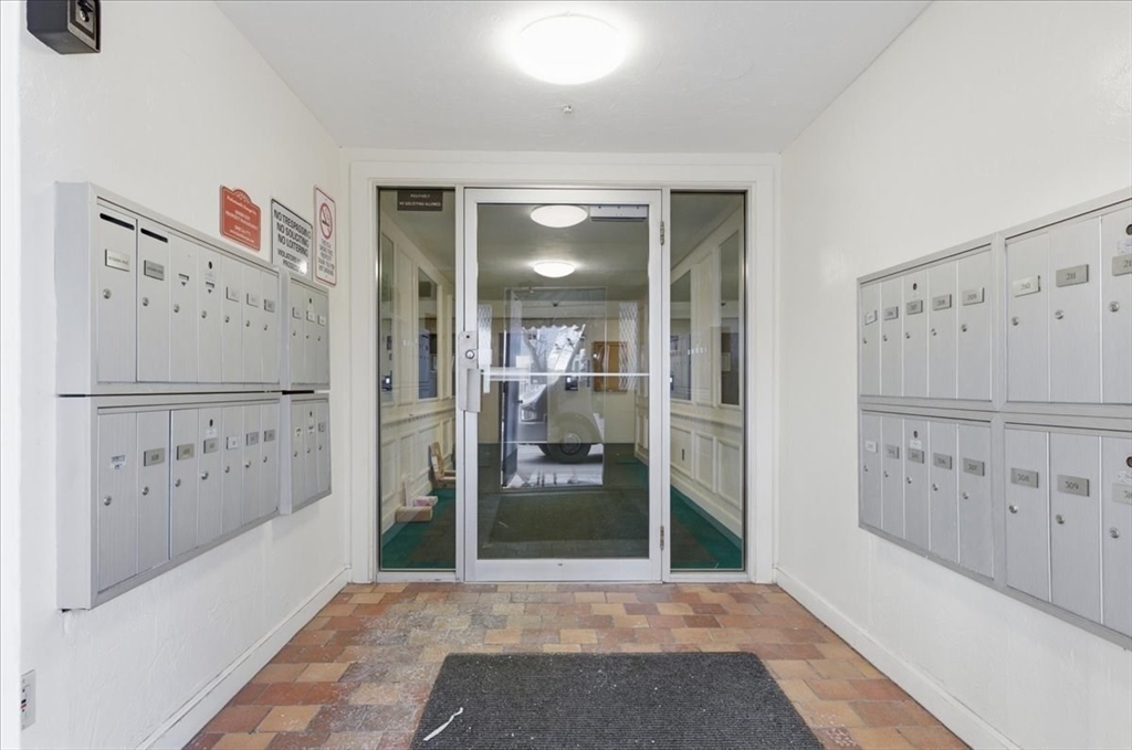 232 Canton Street, Unit 308 Randolph, MA 02368 - Photo 24 of 41 a view of a hallway with elevator