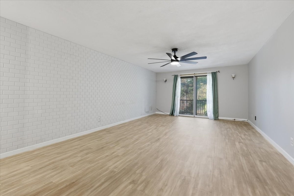 232 Canton Street, Unit 308 Randolph, MA 02368 - Photo 3 of 41 wooden floor in an empty room with a window