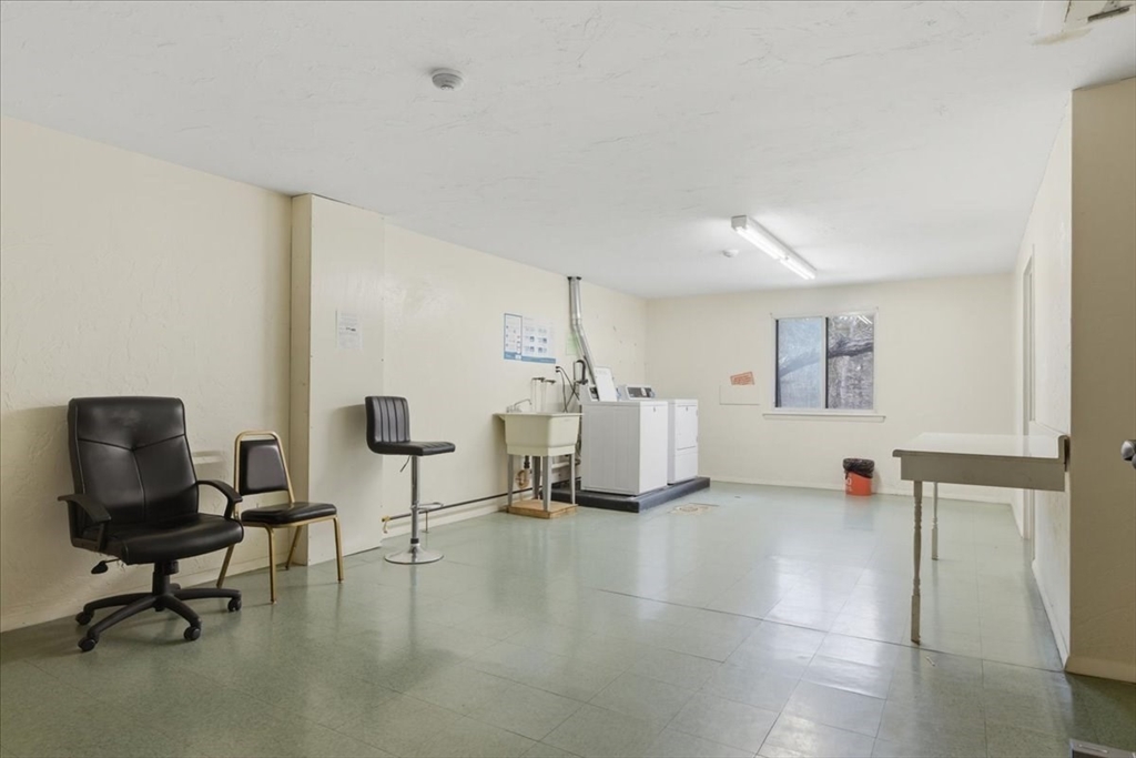 232 Canton Street, Unit 308 Randolph, MA 02368 - Photo 32 of 41 a living room with furniture