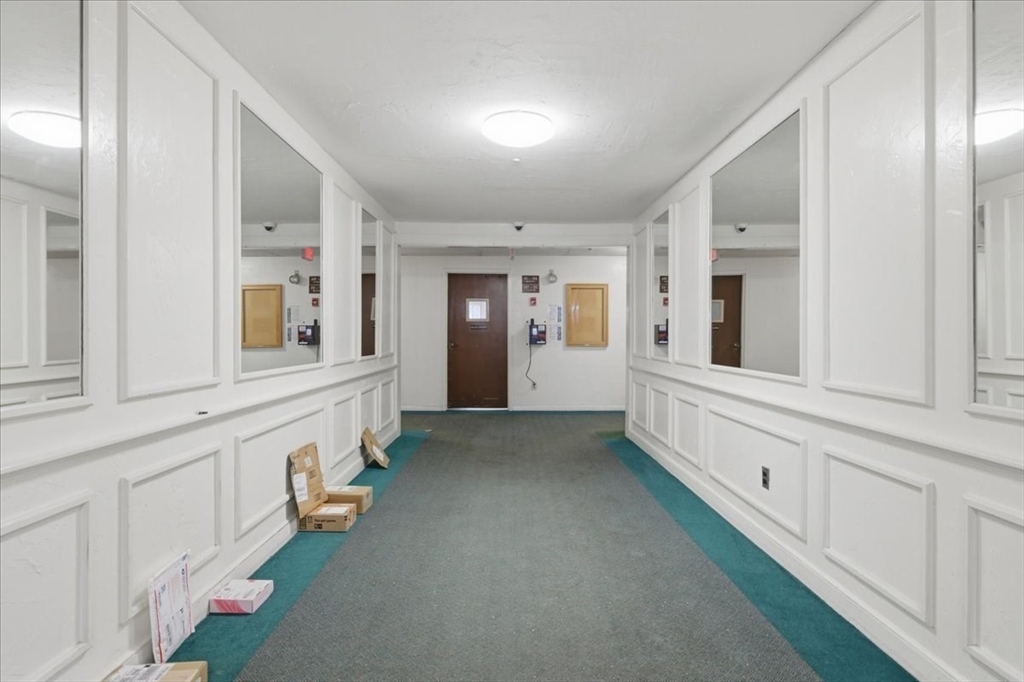 232 Canton Street, Unit 308 Randolph, MA 02368 - Photo 34 of 41 a view of a hallway with windows