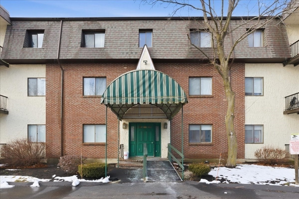 232 Canton Street, Unit 308 Randolph, MA 02368 - Photo 37 of 41 a front view of a house with a yard