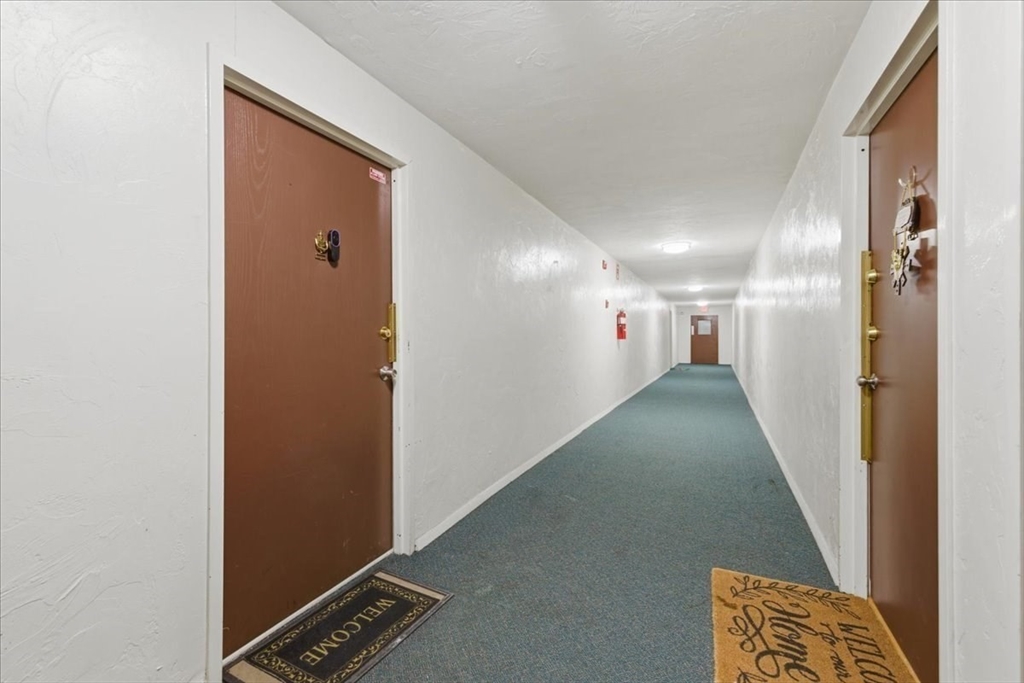 232 Canton Street, Unit 308 Randolph, MA 02368 - Photo 40 of 41 a view of hallway with stairs