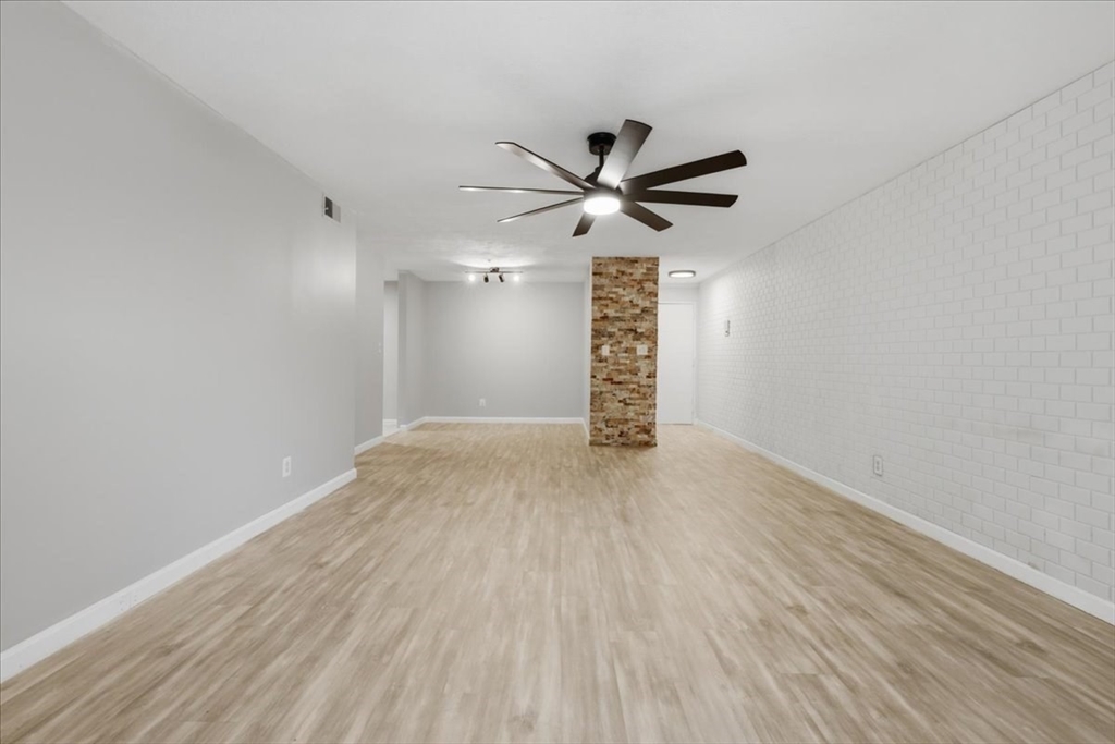 232 Canton Street, Unit 308 Randolph, MA 02368 - Photo 5 of 41 wooden floor in an empty room with a window