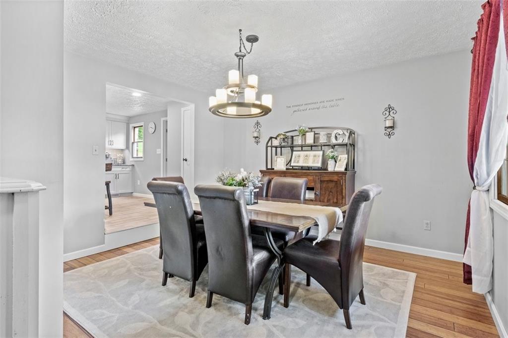 112 Sandy Hill Road Valencia, PA 16059 - Photo 12 of 24 a view of a dining room with furniture and chandelier