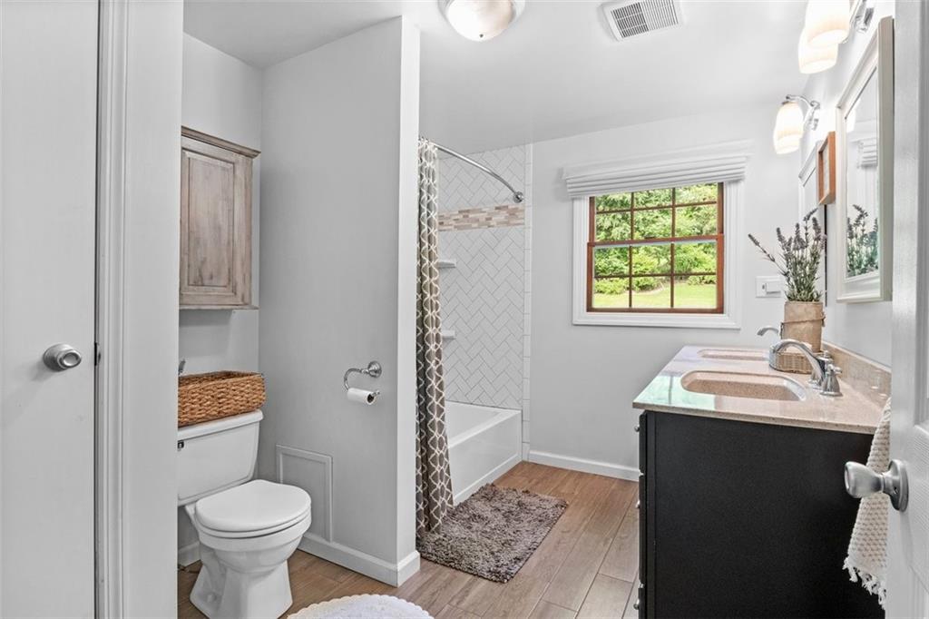 112 Sandy Hill Road Valencia, PA 16059 - Photo 19 of 24 a bathroom with a sink toilet and a mirror