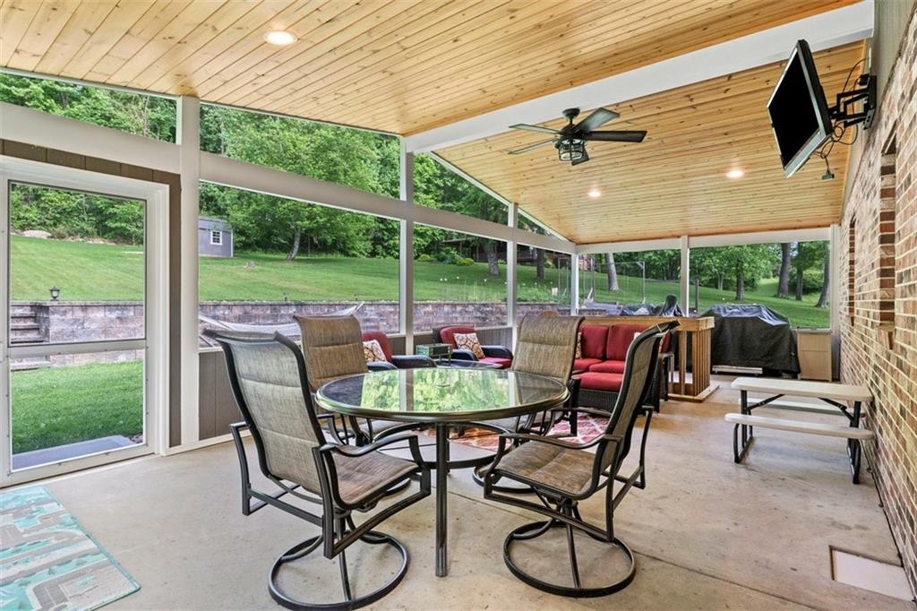 112 Sandy Hill Road Valencia, PA 16059 - Photo 21 of 24 a view of a patio with a table chairs and a backyard