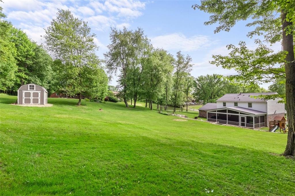 112 Sandy Hill Road Valencia, PA 16059 - Photo 23 of 24 a view of a house with a big yard and large trees