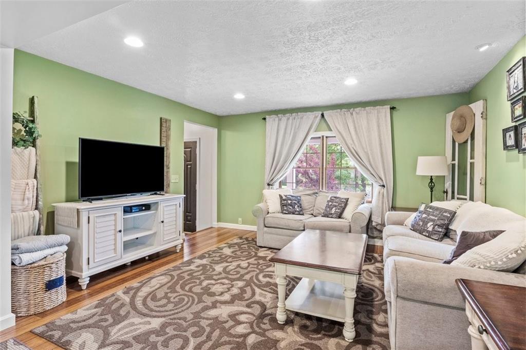 112 Sandy Hill Road Valencia, PA 16059 - Photo 6 of 24 a living room with furniture and a flat screen tv