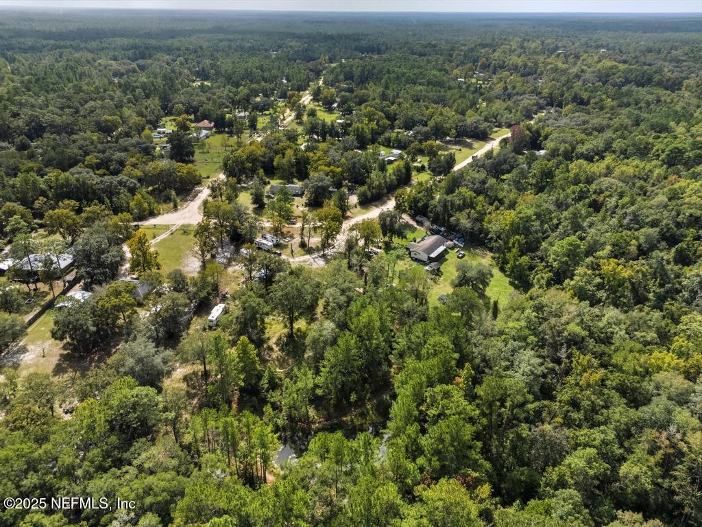 1886 Gentlebreeze Road Middleburg, FL 32068 - Photo 1 of 15 an aerial view of residential houses with outdoor space and trees