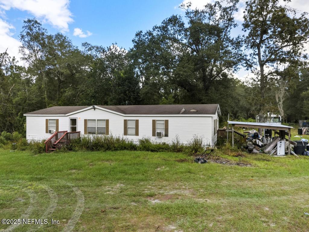 1886 Gentlebreeze Road Middleburg, FL 32068 - Photo 13 of 15 a view of a house with backyard