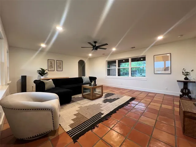 a living room with furniture and a table