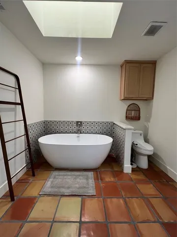 a view of a swimming pool with a lounge chair