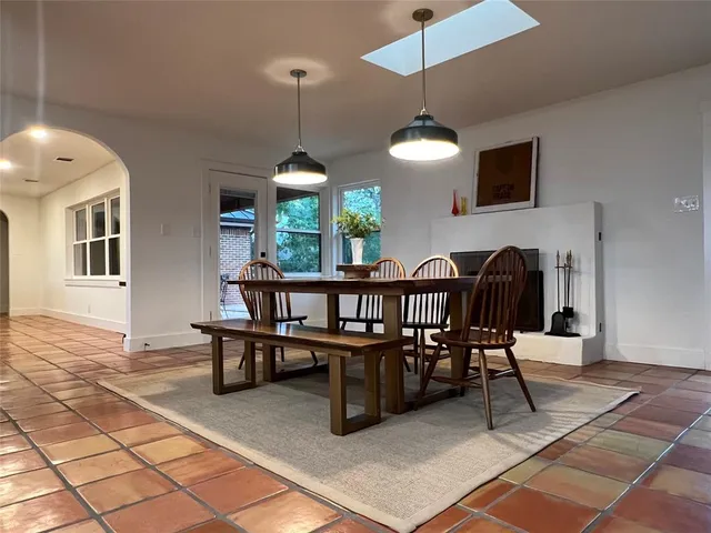 a view of a livingroom with furniture and staircase