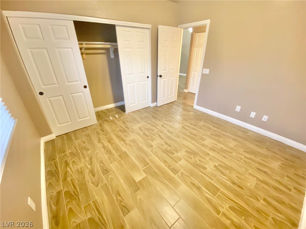 2000 Turquoise Ridge Street, Unit 204 Las Vegas, NV 89117 - Photo 20 of 29 Wood-look tiled flooring and a convenient sliding door closet outfit this inviting space.